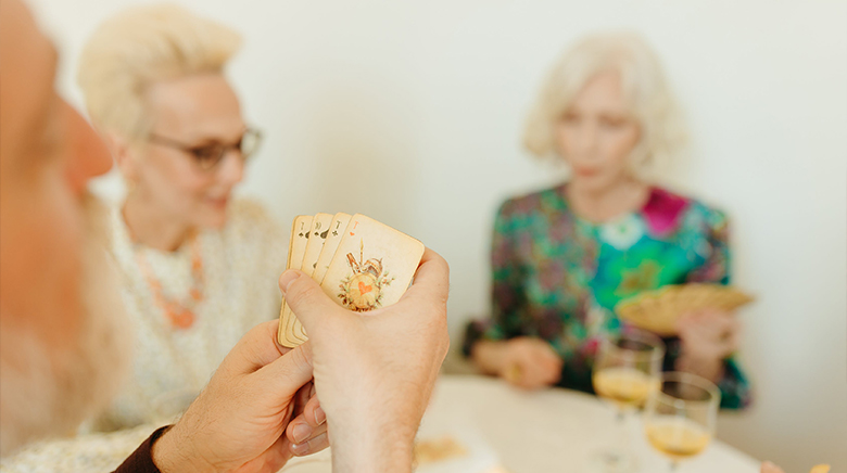3 women playing cards